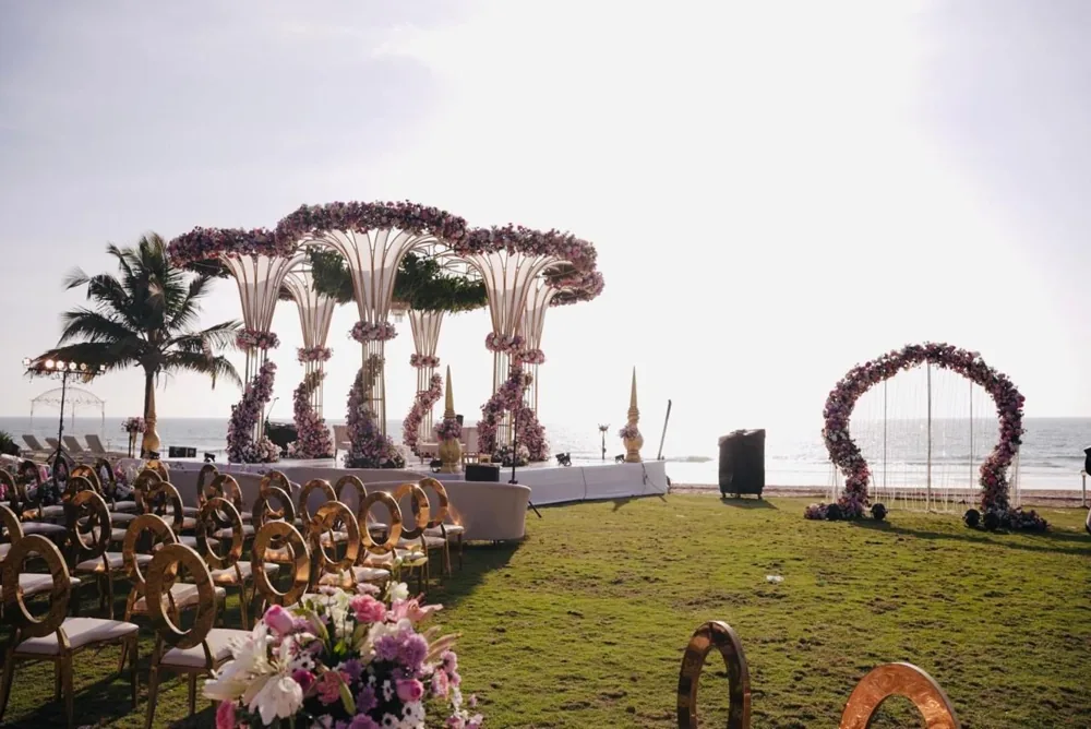 Beachfront mandap palm arches — completed Panigrahana work