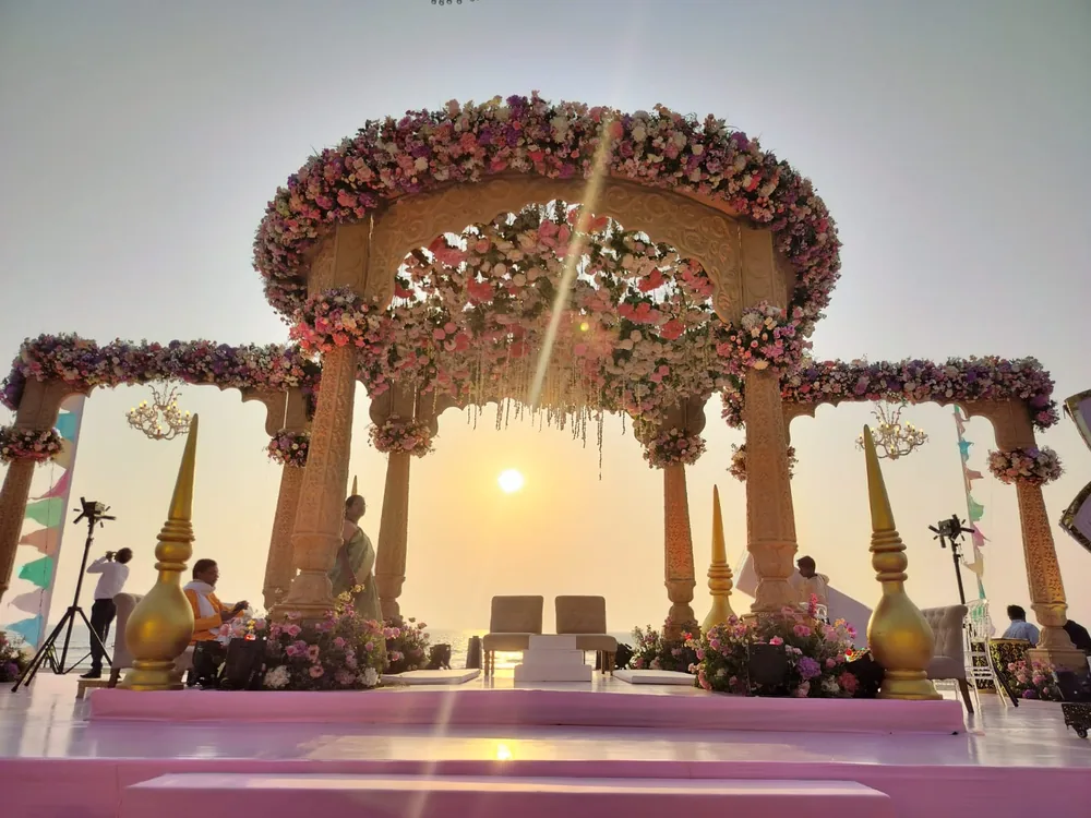 Circular floral mandap at sunset at The St. Regis Goa Resort — Panigrahana decor portfolio