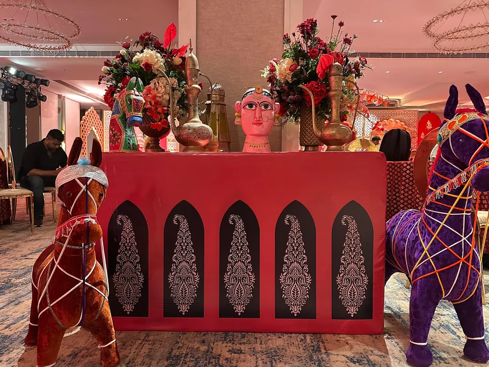Red patterned counter with decorative horse figures at The St. Regis Goa Resort — Panigrahana decor portfolio