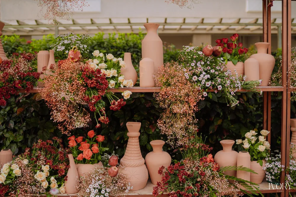Terracotta vase wall florals — completed Panigrahana work